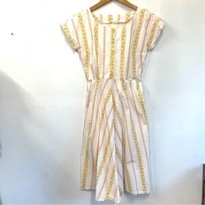 Cheerful vintage mid-century style summer dress with flowers and pinstripes
